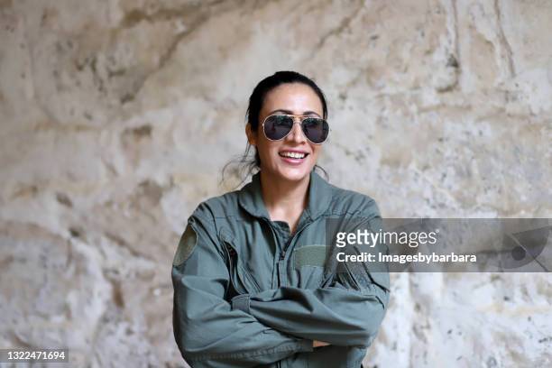 mid aged adult female who is in the air forced dresses in a aviator outfit. - aviator sunglasses stock pictures, royalty-free photos & images
