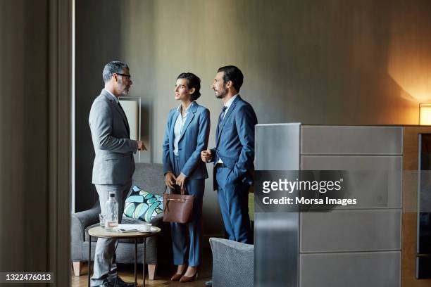 business professionals discussing in hotel - well dressed group stock pictures, royalty-free photos & images