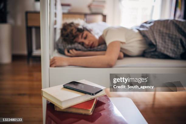 woman sleeping at home - night table stock pictures, royalty-free photos & images