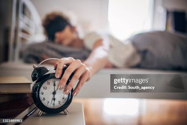 woman waking up early - alarm clock close up stock pictures, royalty-free photos & images