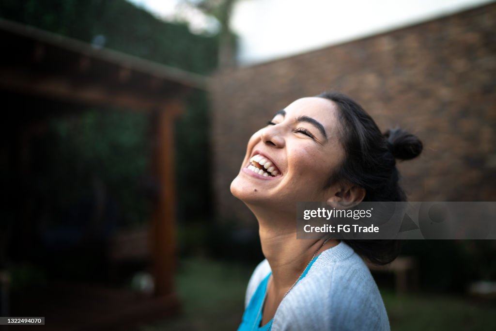 Happy woman inhaling at home