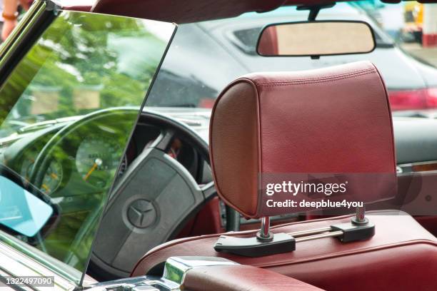 view from the side into the interior of a vintage convertible mercedes - head rest stock pictures, royalty-free photos & images