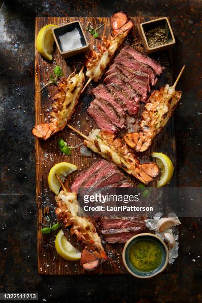 top sirloin bbq steaks with skewered lobster tails - lobster seafood stock pictures, royalty-free photos & images