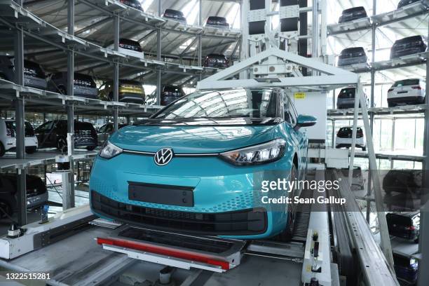 Volkswagen ID.3 electric cars stand in the storage tower following assembly at the "Gläserne Manufaktur" production facility on June 08, 2021 in...