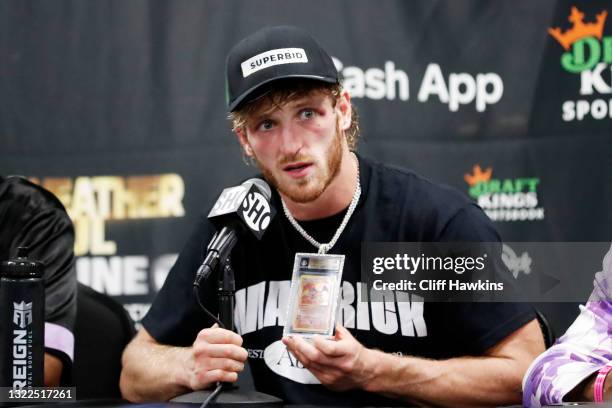 Logan Paul talks about his Charizard Pokemon card chain during his press conference following his contracted exhibition boxing match against Floyd...