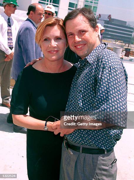 Actress Carrie Fisher and her brother Todd Fisher, the children of actress Debbie Reynolds, pose at the unveiling of the site of the new Hollywood...
