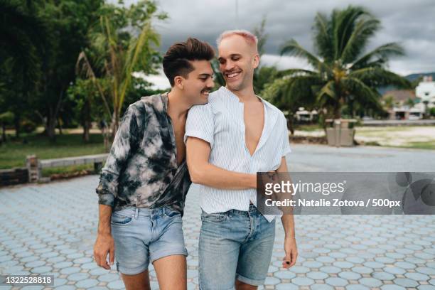 gay couple spend time together outdoors,ko pha ngan,thailand - ko phangan stock pictures, royalty-free photos & images
