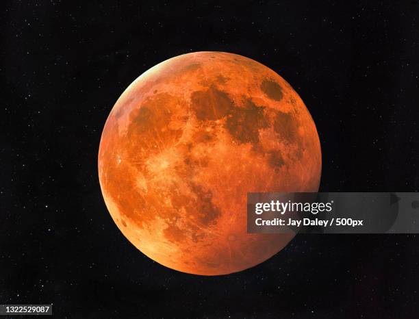 low angle view of moon against sky at night,sydney,new south wales,australia - maansverduistering stockfoto's en -beelden