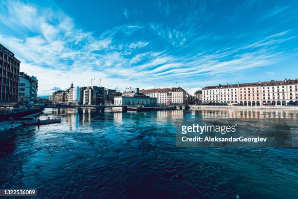 rhône river at the center of geneva, switzerland - rhone river stock pictures, royalty-free photos & images