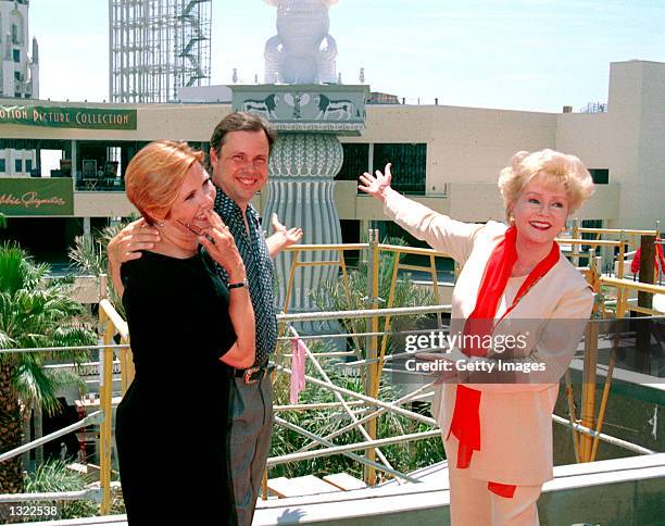 Actress Debbie Reynolds, right, poses with her children Carrie Fisher, left, and Todd Fisher June 19, 2001 in Hollywood at the unveiling of the site...