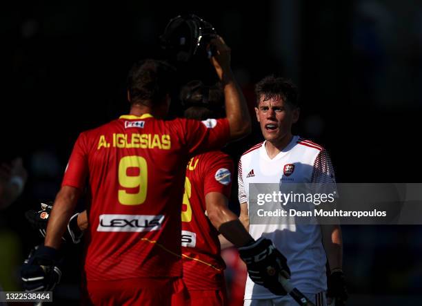 Thomas Sorsby of England speaks to Josep Romeu Argemi and Alvaro Iglesias Marcos of Spain during the Euro Hockey Championships Men match between...