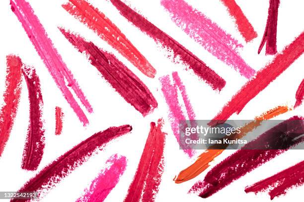 red, pink, burgundy lipstick smears on white background. isolated for design. lip gloss samples are smudged. beauty cosmetic banner. makeup and skin care products. closeup. cosmetology. - red lipstick kiss stock pictures, royalty-free photos & images