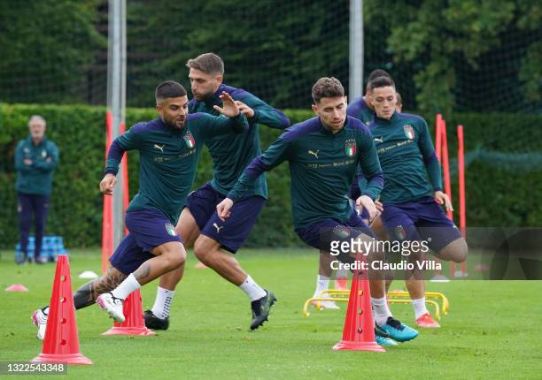 Lorenzo Insigne and Jorginho of Italy in action during a Italy training session at Centro Tecnico Federale di Coverciano on June 08, 2021 in...