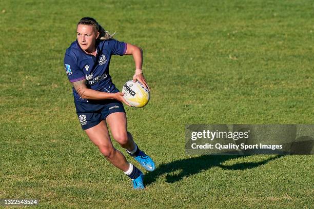 Chloe Rollie of Scotland runs with the ball during the match between Scotland and Romania of Women Rugby Europe Sevens Championship Series Lisbon...