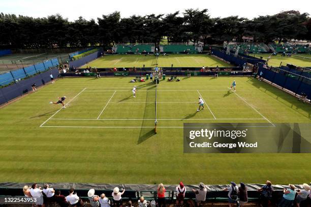 General view of play in the doubles match between Matt Reid of Australia, Ken Skupski of Great Britain and Mackenzie McDonald, Brandon Nakashima of...