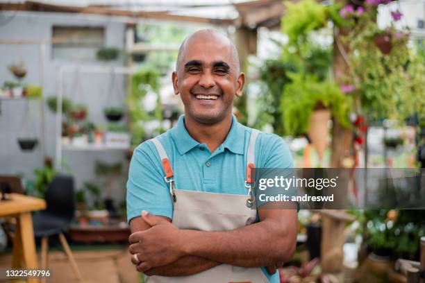 small businessman smiling looking at camera. - only mature men imagens e fotografias de stock