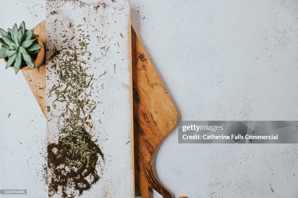 Loose green tea scattered over a marble surface