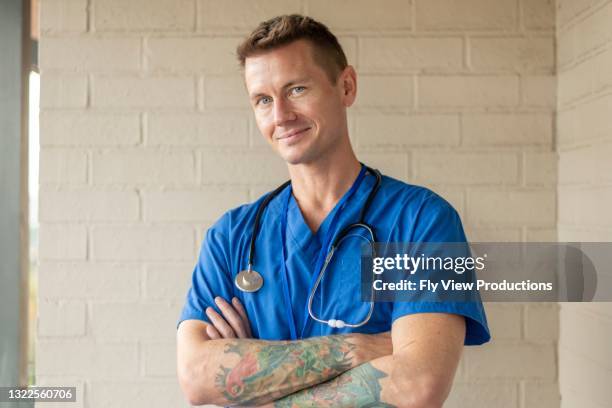 here to look after you! - doctor scrubs stock pictures, royalty-free photos & images