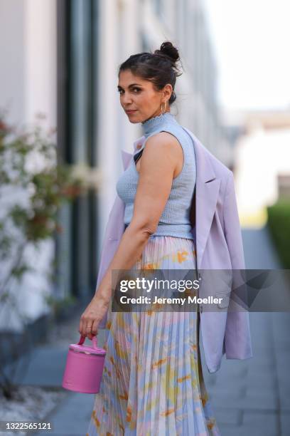 Anna Wolfers wearing blue crop top, colorful midi skirt, light purple blazer, all via Goldig Shop and pink mini bag on May 31, 2021 in Hamburg,...