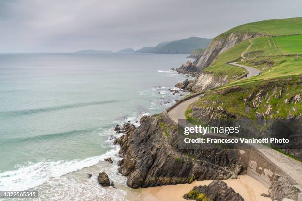 road at dunmore head - devil horns, ireland. - republic of ireland stock pictures, royalty-free photos & images