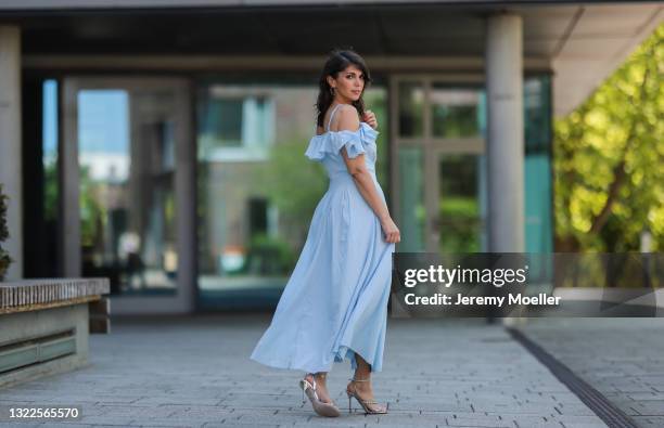 Anna Wolfers wearing light blue flowy dress via Goldig Shop and blue heels on May 31, 2021 in Hamburg, Germany.