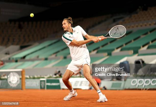 Daniil Medvedev of Russia plays a backhand in their mens singles quarter final match against Stefanos Tsitsipas of Greece during day ten of the 2021...