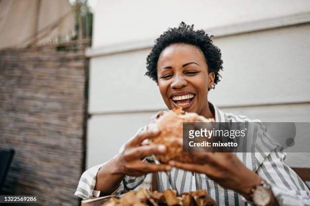 wow look amazing - sandwich eating woman stock pictures, royalty-free photos & images