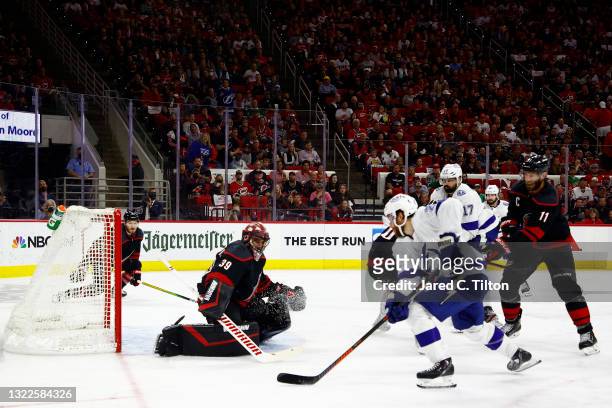 Brayden Point of the Tampa Bay Lightning shoots and scores against Alex Nedeljkovic of the Carolina Hurricanes during the second period in Game Five...