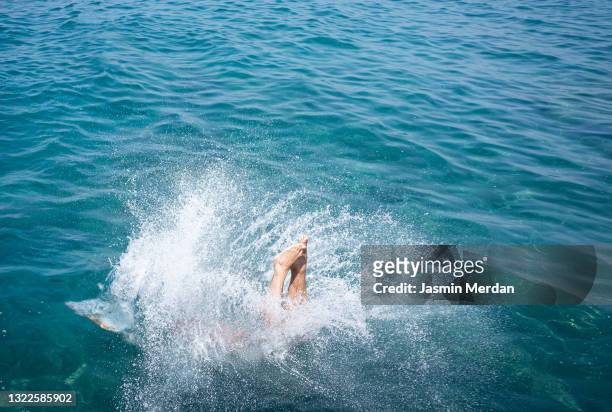 mid adult man on sea pier for diving - water side view stock pictures, royalty-free photos & images