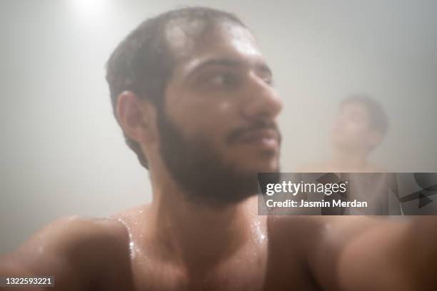 boys enjoying the steam - young boy in sauna stock pictures, royalty-free photos & images