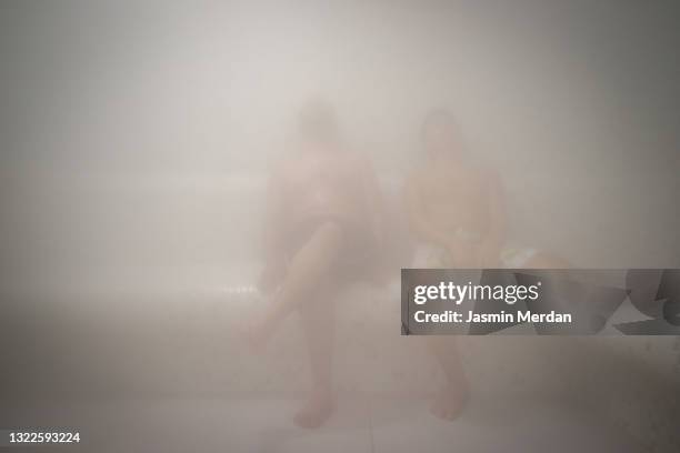 boys enjoying the steam - steam room stock pictures, royalty-free photos & images