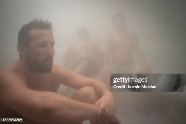 mature man in steam room sauna - young boy in sauna stock pictures, royalty-free photos & images