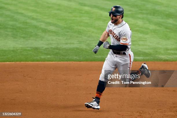 Mike Tauchman of the San Francisco Giants celebrates while rounding the bases after hitting a grand slam home run against the Texas Rangers in the...