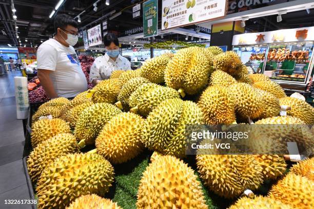 Customers purchase durians at a supermarket on June 9, 2021 in Shijiazhuang, Hebei Province of China.