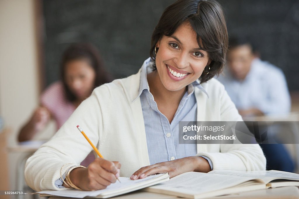 Young woman studying in classroom