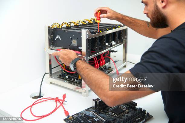 An employee is seen building a cryptocurrency units to mine and to trade bitcoin at Trio Mining on June 3,2021 in London, England.