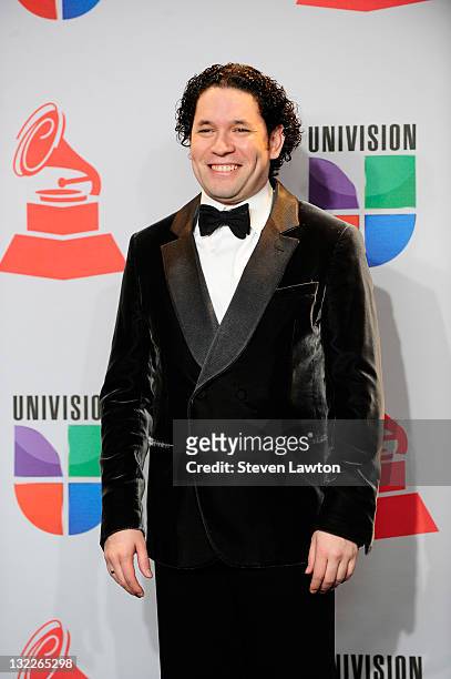 Los Angeles Philharmonic conductor Gustavo Dudamel poses in the press room during the 12th annual Latin GRAMMY Awards at the Mandalay Bay Resort &...