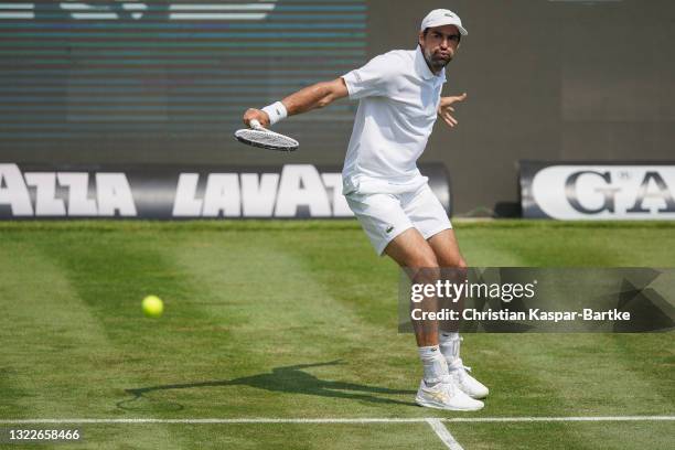 Jeremy Chardy of France plays a backhand during his match against Yannick Hanfmann of Germany during day 3 of the MercedesCup at Tennisclub...