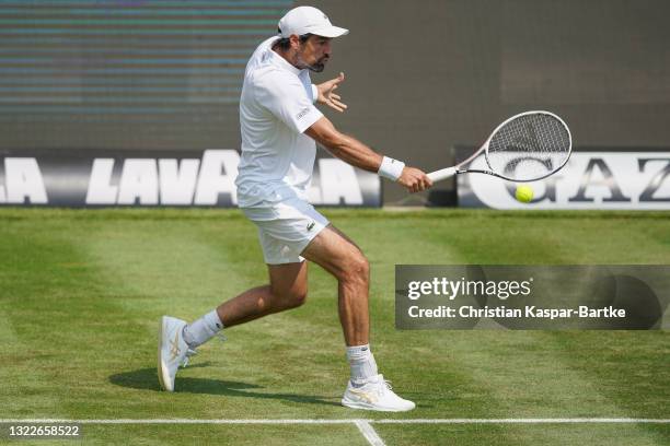 Jeremy Chardy of France plays a backhand during his match against Yannick Hanfmann of Germany during day 3 of the MercedesCup at Tennisclub...