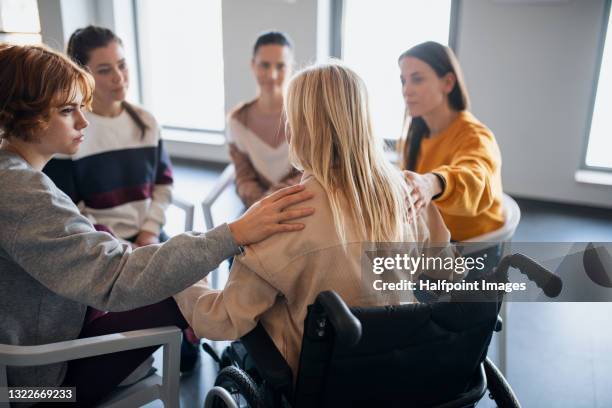 depressed senior woman in wheelchair on group therapy, counselling and coronavirus concept. - covid persons with disabilities stock pictures, royalty-free photos & images