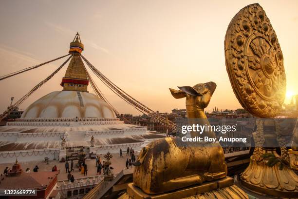 beautiful view of the great boudhanath stupa in kathmandu, nepal at sunset. - kathmandu stock pictures, royalty-free photos & images