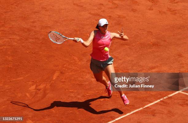 Iga Swiatek of Poland hits a forehand during her Ladies Singles Quarter-Final match against Maria Sakkari of Greece on Day Eleven of the 2021 French...