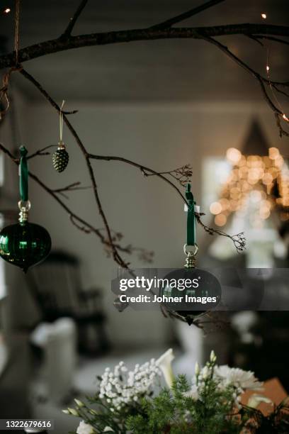 green christmas ornaments on branch - christmas scandinavia stock pictures, royalty-free photos & images