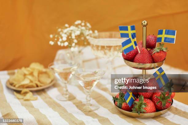 food for traditional midsummer feast - swedish flag stock pictures, royalty-free photos & images