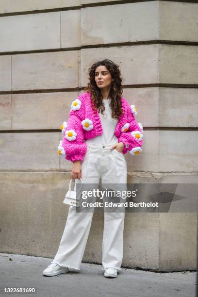 Ketevan Giorgadze @katie.one wears a white ribbed top from Zara, a chunky knit neon hot pink / fuchsia oversized crop cardigan with handmade...