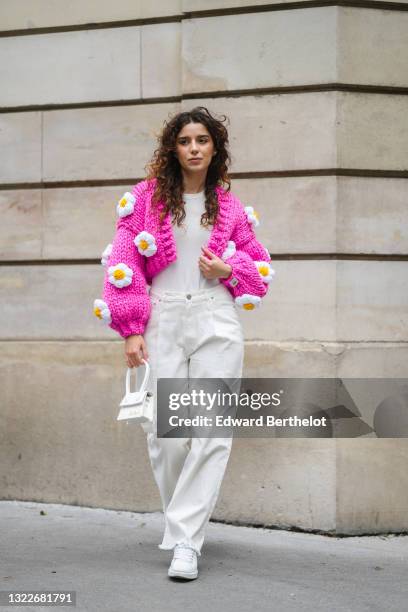 Ketevan Giorgadze @katie.one wears a white ribbed top from Zara, a chunky knit neon hot pink / fuchsia oversized crop cardigan with handmade...