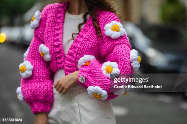 Ketevan Giorgadze @katie.one wears a white ribbed top from Zara, a chunky knit neon hot pink / fuchsia oversized crop cardigan with handmade...