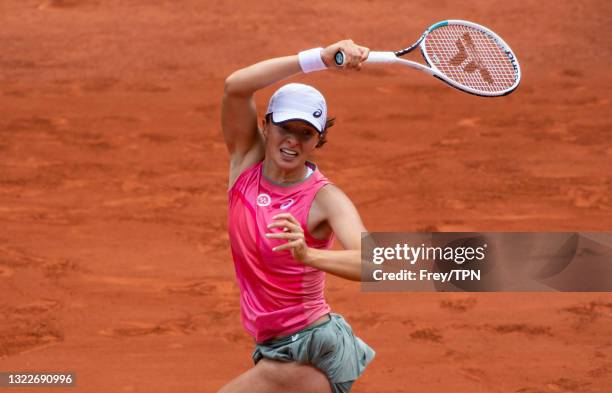 Iga Swaitek of Poland hits a forehand against Maria Sakkari of Greece in the quarterfinals of the women's singles at Roland Garros on June 09, 2021...