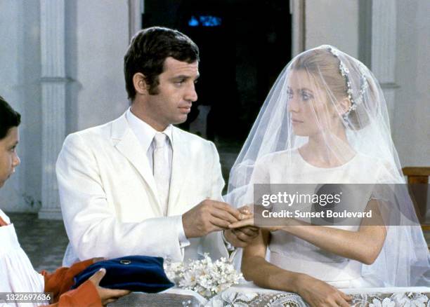 French actor Jean-Paul Belmondo and french actress Catherine Deneuve on the set of the 1969 French film La Sirene du Mississipi .