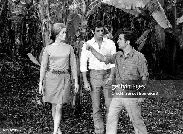 French actress Catherine Deneuve, french actor Jean-Paul Belmondo and director Francois Truffaut on the set of the 1969 French film La Sirene du...